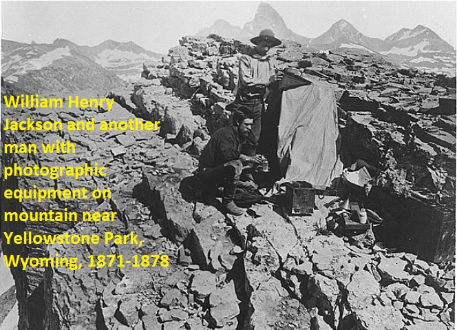 screenshot from Library of Congress collection of photos in the public domain: photographers with view camera on rocky outcrop